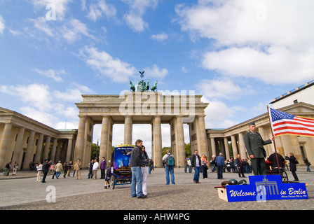 Horizontal wide angle of the Brandenburg Gate with lots of tourists at Pariser Platz on a bright sunny day. Stock Photo