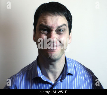 Middle aged man looking under pressure Stock Photo