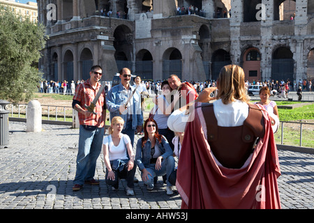 Locals dressed as Roman Centurions take photos of tourists for money outside the Colosseum Rome Lazio Italy Stock Photo