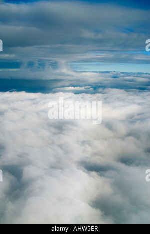 Horizontal aerial view of cloud layers and different formations in a blue sky from a high altitude Stock Photo