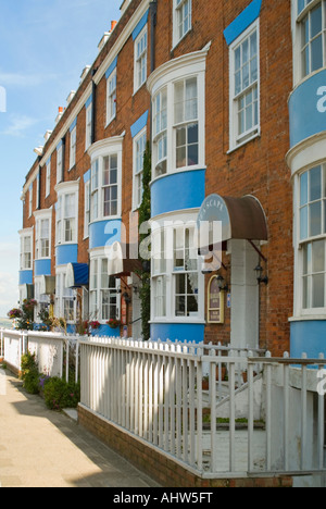 Vertical view of a typical row of terraced houses converted to Bed and Breakfast Hotels along the seafront at Weymouth. Stock Photo