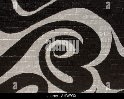 Black pattern painted on white wall Stock Photo
