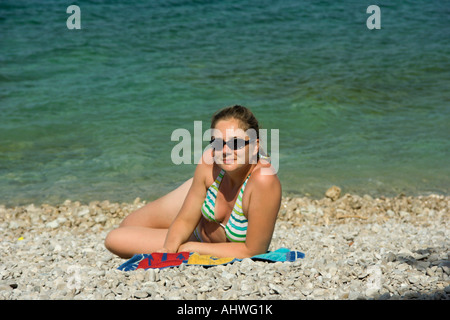 Woman on a Croatian beach Stock Photo