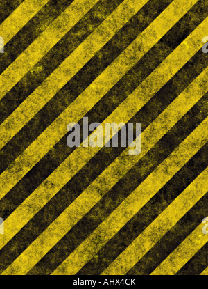 old grungy yellow hazard stripes on black road Stock Photo