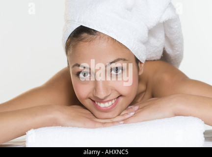 Smiling woman with towel on head Stock Photo