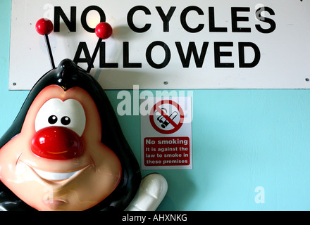 Signs and cartoon figure in amusement arcade in New Brighton Merseyside Stock Photo