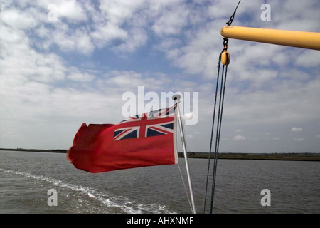 Red Ensign flying from a tourist pleasure boat on the river Alde, Suffolk, East Anglia Stock Photo