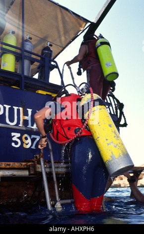 Egypt Sharm el Sheik Red Sea Diver boarding boat after dive Stock Photo