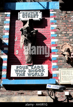 Signs and figures commemorating The Beatles and John Lennon in Mathew Street Liverpool Stock Photo