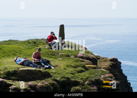 dh Marwick Head BIRSAY ORKNEY Tourist birdwatchers viewing RSPB Nature reserve on seacliff top