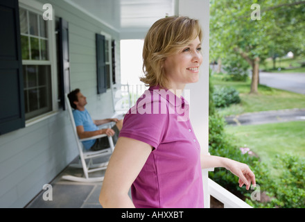 Couple relaxing on porch Stock Photo