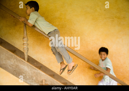 Bolivian children playing on the staircase at the mission of Santa Ana,  Bolivia Stock Photo