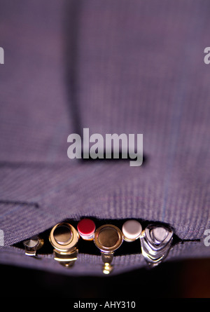 row of pens and pencils in suit pocket Stock Photo