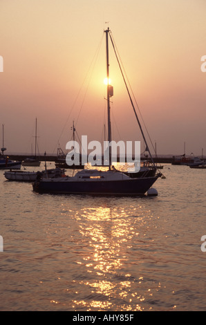 West Mersea boats moored in the Strood Channel at sunset Stock Photo