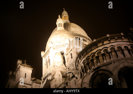 Sacre Coeur church in Montmartre Paris floodlit at night Stock Photo