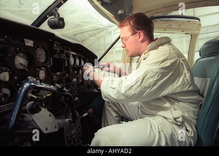 British Airways aircraft maintenance trainees working on a Piper Aztec Turbo Prop at training facility in Barry South Wales UK Stock Photo