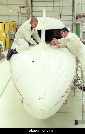 British Airways aircraft maintenance trainees working on a Hawker Siddley 125 jet at training facility in Barry South Wales UK Stock Photo