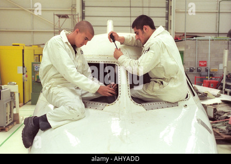 British Airways aircraft maintenance trainees working on a Hawker Siddley 125 jet at training facility in Barry South Wales UK Stock Photo