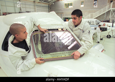 British Airways aircraft maintenance trainees working on a Hawker Siddley 125 jet at training facility in Barry South Wales UK Stock Photo