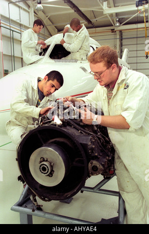 British Airways aircraft maintenance trainees working on a Hawker Siddley 125 jet at training facility in Barry South Wales UK Stock Photo