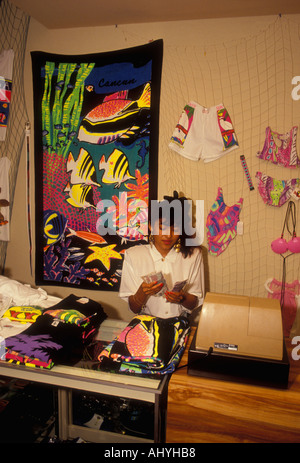 1 one Mexican woman young adult salesclerk working at clothing store fashion boutique in Cancun in Quintana Roo State in Yucatan Peninsula in Mexico Stock Photo