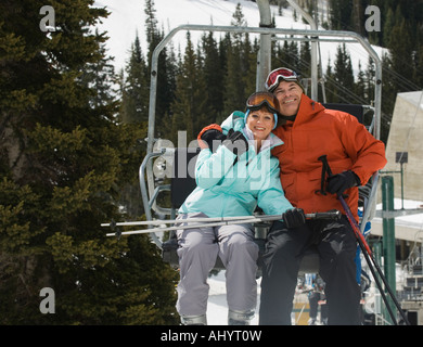 Couple on ski lift Stock Photo