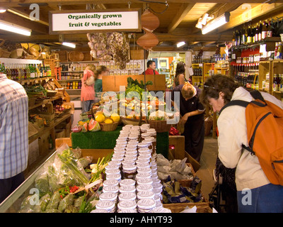 customers buying food in organic food store in Sussex England Stock Photo