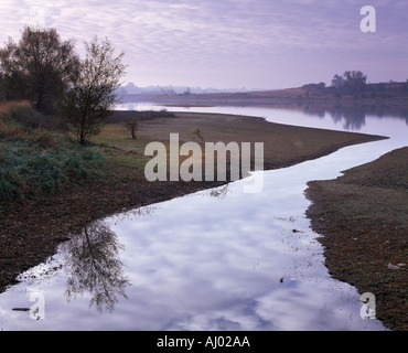 Nice evocative view of the fresh water reservoir at Boddington early in the day with a fine mist Northamptonshire Stock Photo