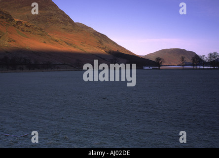 ENGLAND Cumbria Lake District National Park Early morning light illuminates the hills surrounding Lake Buttermere and Peggy  Stock Photo