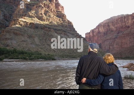 Couple looking at river, Colorado River, Moab, Utah, United States Stock Photo