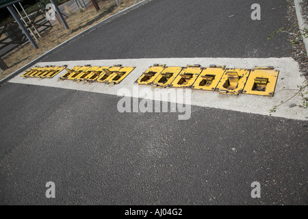 Control plate traffic control barrier to block a road Stock Photo