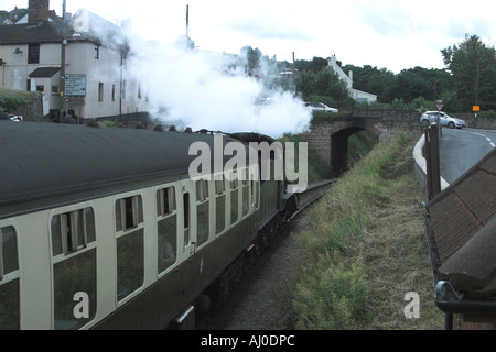 Steam train leaving Watchet station heading towards Minehead. Somerset Steam Railway. Somerset. England