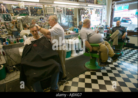 Floyd cutting hair at Floyd s City Barber Shop in Mount Airy North Carolina the town featured in Mayberry RFD and home of Andy Stock Photo