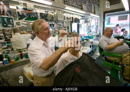 Floyd cutting hair at Floyd s City Barber Shop in Mount Airy North Carolina the town featured in Mayberry RFD and home of Andy Stock Photo