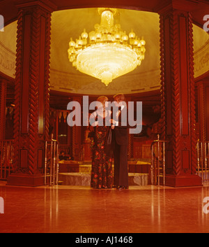 young couple in formal attire in resort hotel lobby in San Juan Puerto Rico Stock Photo