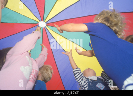 Preschool children playing a parachute game Washington D C Stock Photo