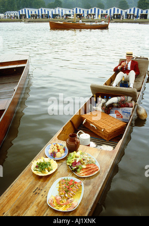 man on punt at Henley regatta with picnic Stock Photo