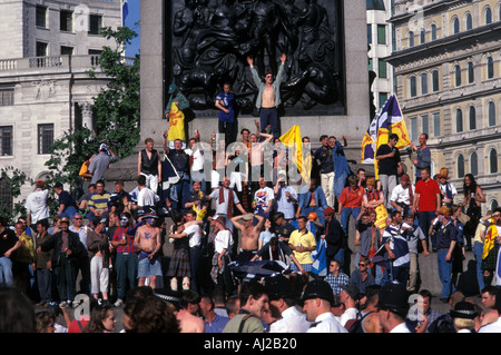 Scottish football fans celebrating a victory in Trafalgar Square London England Britain UK Stock Photo