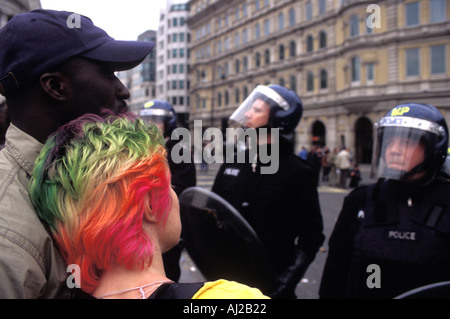 Demonstrators facing riot police in Trafalgar Square London England UK Stock Photo