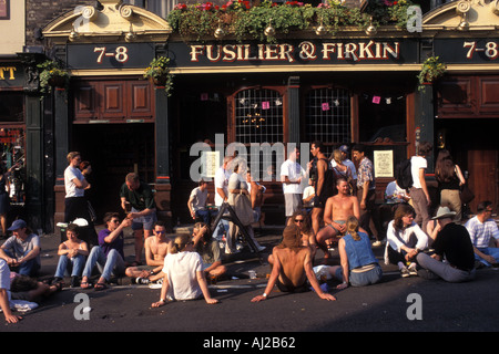 People drinking outside pub in Camden Town London England UK Stock Photo