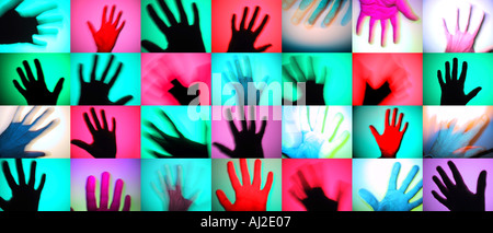 Rows of colourful hands. A modern photographic take on prehistoric rock art. Stock Photo