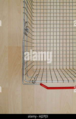 Empty Shopping Basket on a Supermarket Floor Overhead View Stock Photo