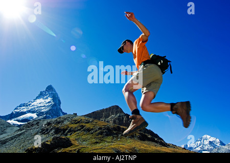 A Matterhorn (4477m) hiker running the trail, Zermatt, Valais, Switzerland Stock Photo