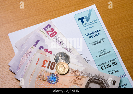 A television licence application form with cash to pay for it Stock Photo