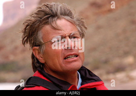 Man wearing a red life jacket and glasses on the Colorado River in Grand Canyon National Park, AZ, USA Stock Photo