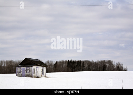 Abandoned farm house in winter Stock Photo