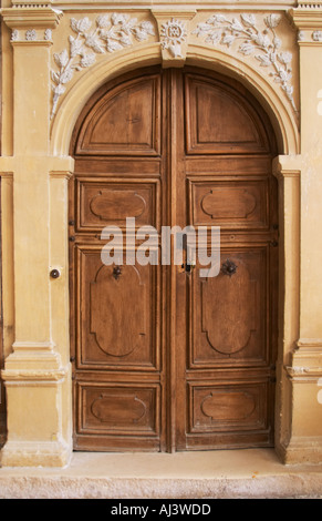 The entrance door to the church where you can find the tomb grave of the monk Dom Pierre Perignon (the father of champagne) is buried, cellar master in the monastery Abbey (1639-1715)., the village of Hautvillers in Vallee de la Marne, Champagne, Marne, Ardennes, France Stock Photo