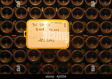 Champagne bottles stacked in an underground vaulted cellar closed with silver and green crown caps capsules in total 129956 bottles at Champagne Deutz in Ay, Vallee de la Marne, Champagne, Marne, Ardennes, France Stock Photo