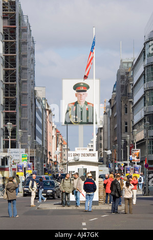 A compressed perspective view of tourists at Checkpoint Charlie on a sunny day. Stock Photo