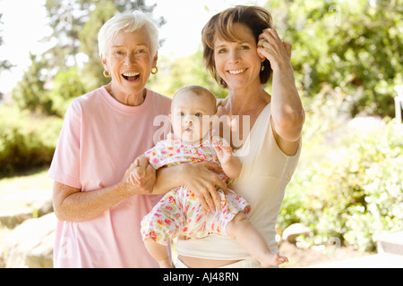 Grandmother and mother holding baby Stock Photo